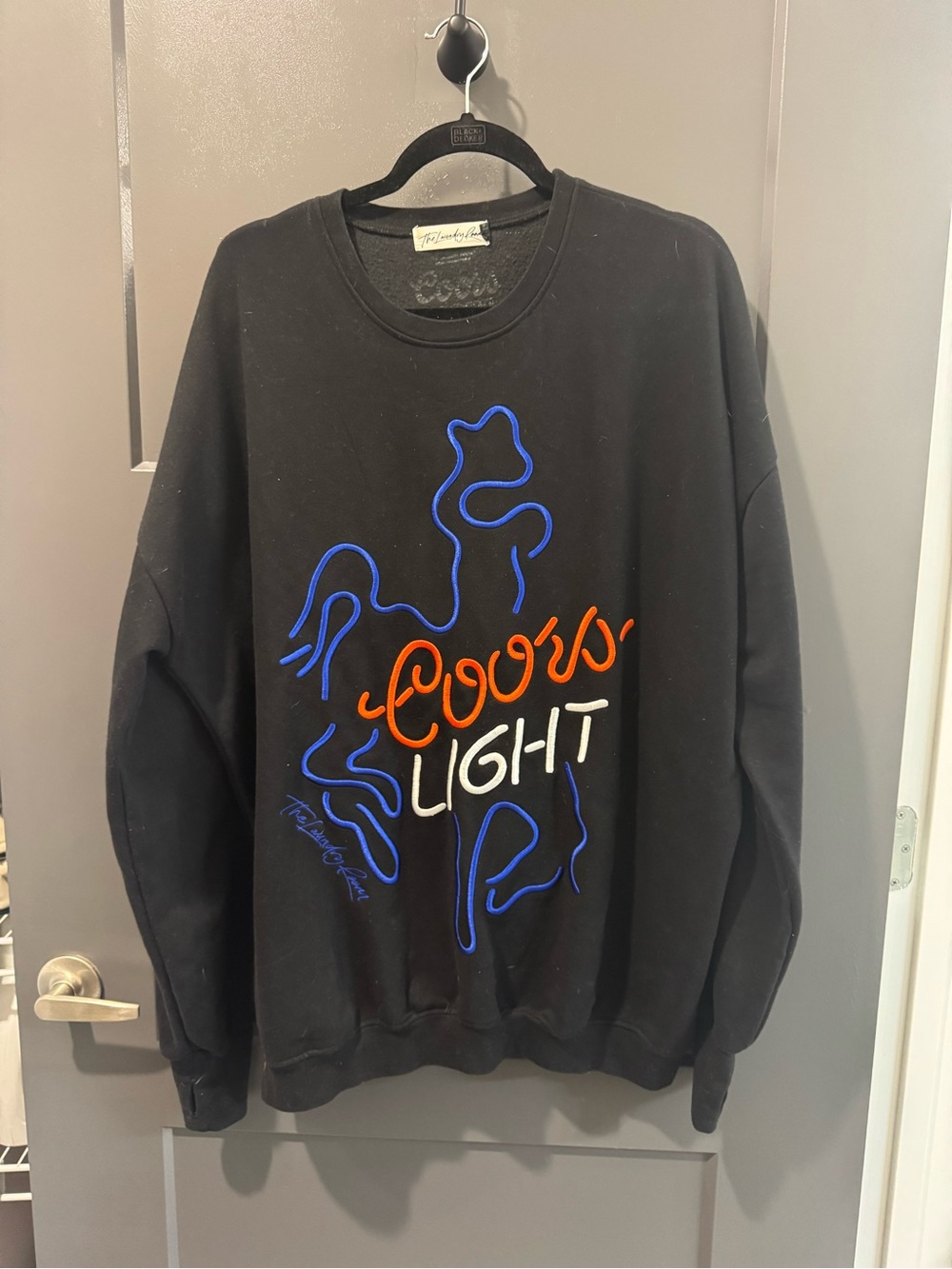 The Laundry Room Black Crewneck with Blue, Orange, and White Graphic